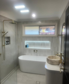 Bathroom project with freestanding bath, walk-in shower and illuminated niche